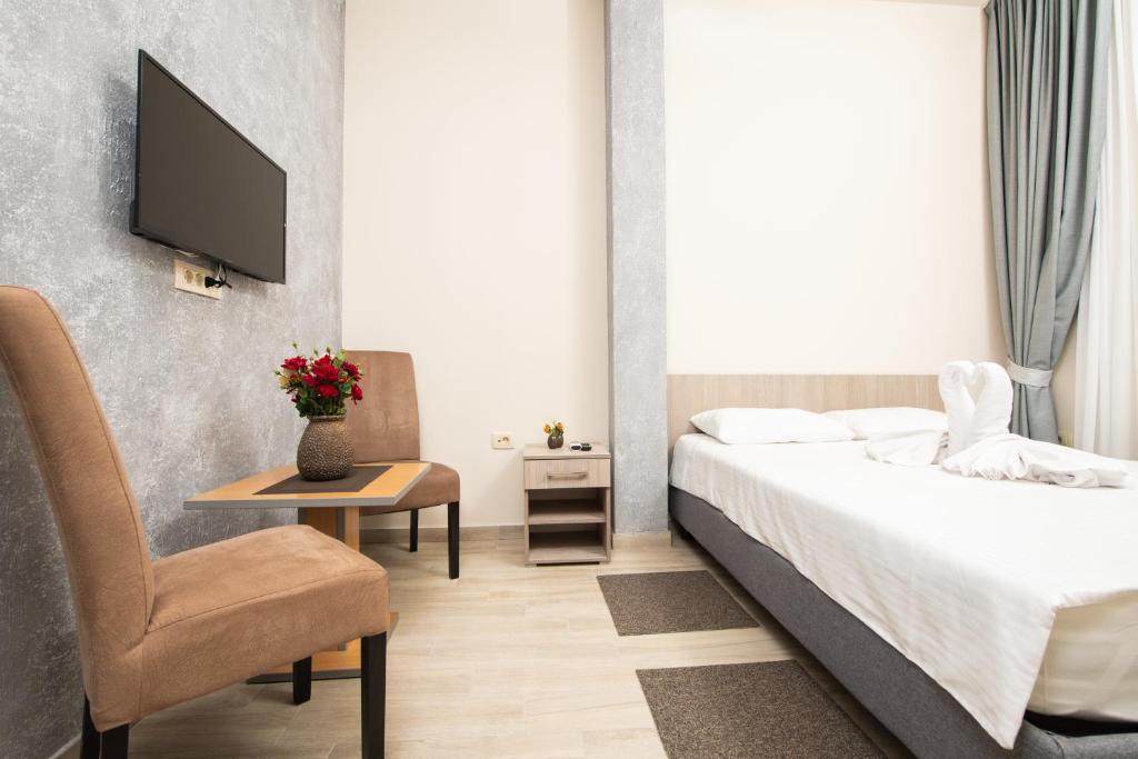 Postel nebo postele na pokoji v ubytování IPN ROOMs