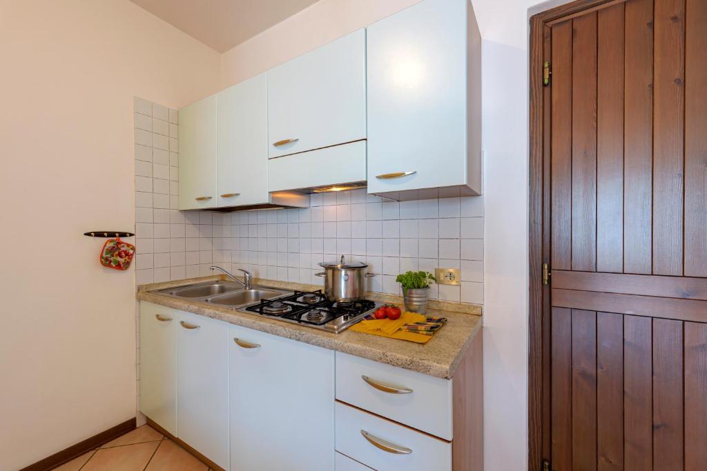 Kuchyň nebo kuchyňský kout v ubytování Residence Ruculì - Ruculì Hospitality
