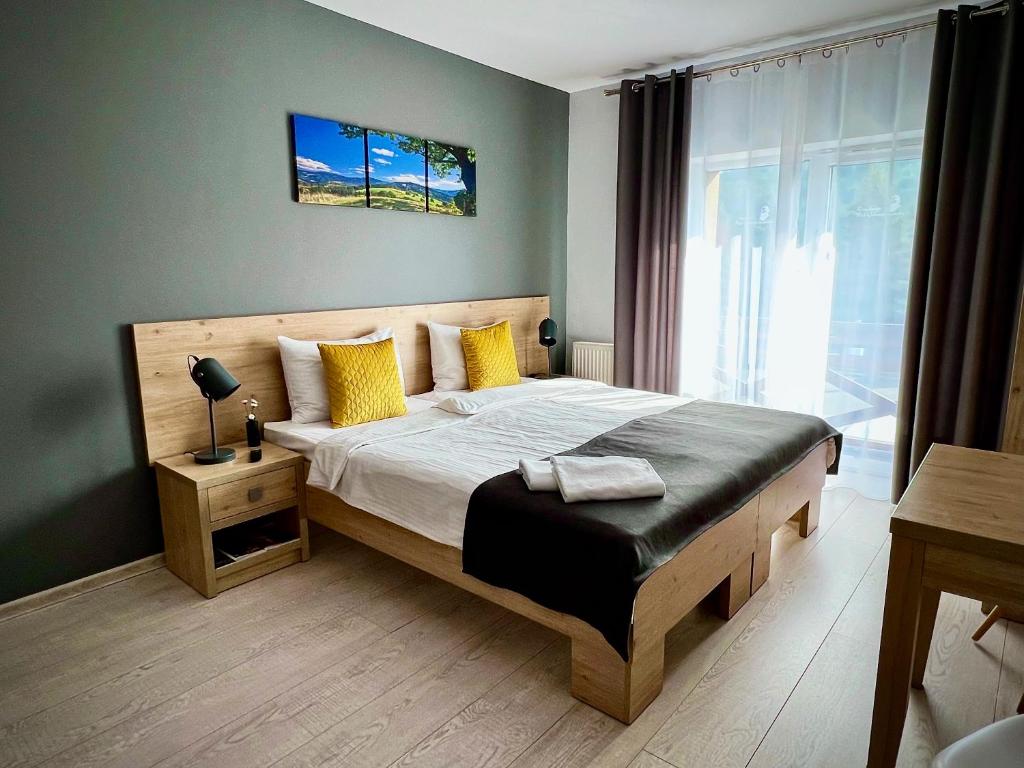 Posteľ alebo postele v izbe v ubytovaní Rezydencja Pod Ochorowiczówką B&B