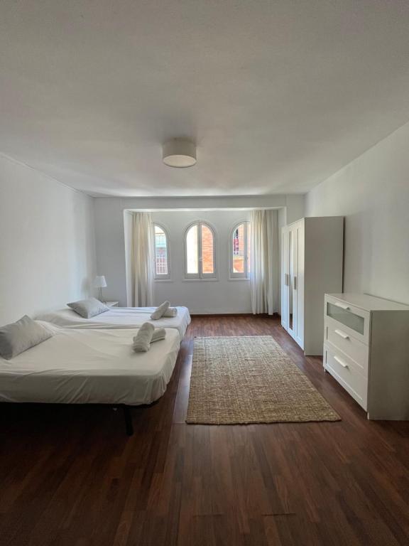 Posteľ alebo postele v izbe v ubytovaní IRUA APARTAMENTOS