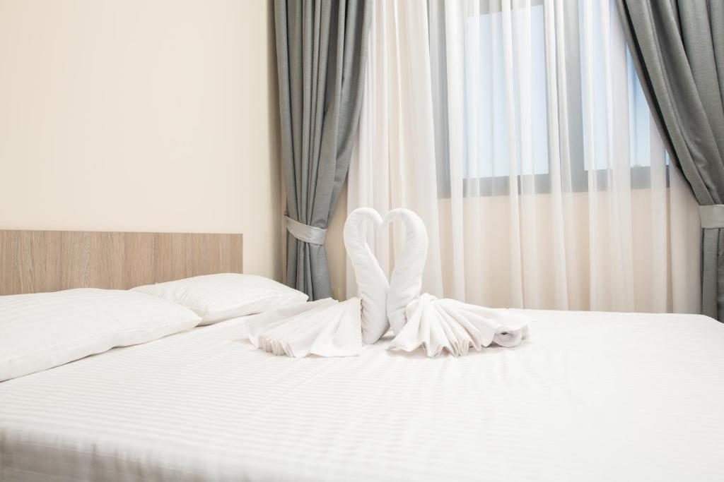 Postel nebo postele na pokoji v ubytování IPN ROOMs
