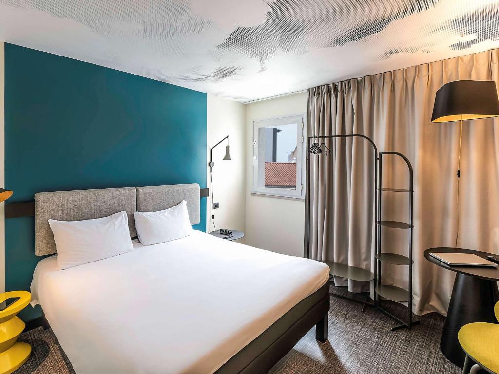 Postel nebo postele na pokoji v ubytování Hotel ibis Lisboa Saldanha