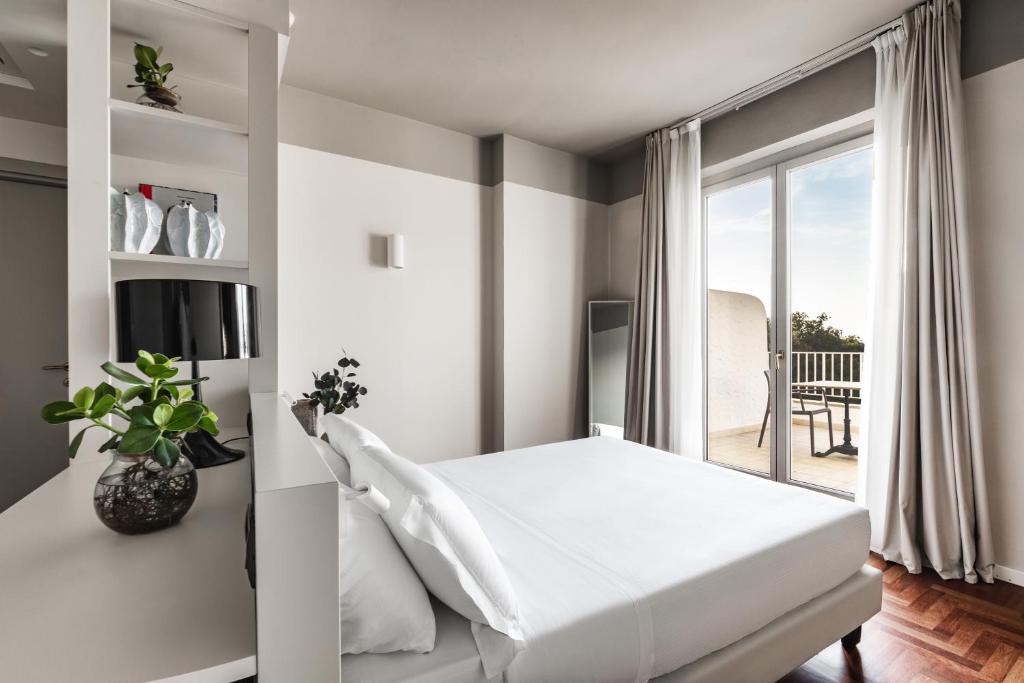 Postel nebo postele na pokoji v ubytování SeeBay Hotel