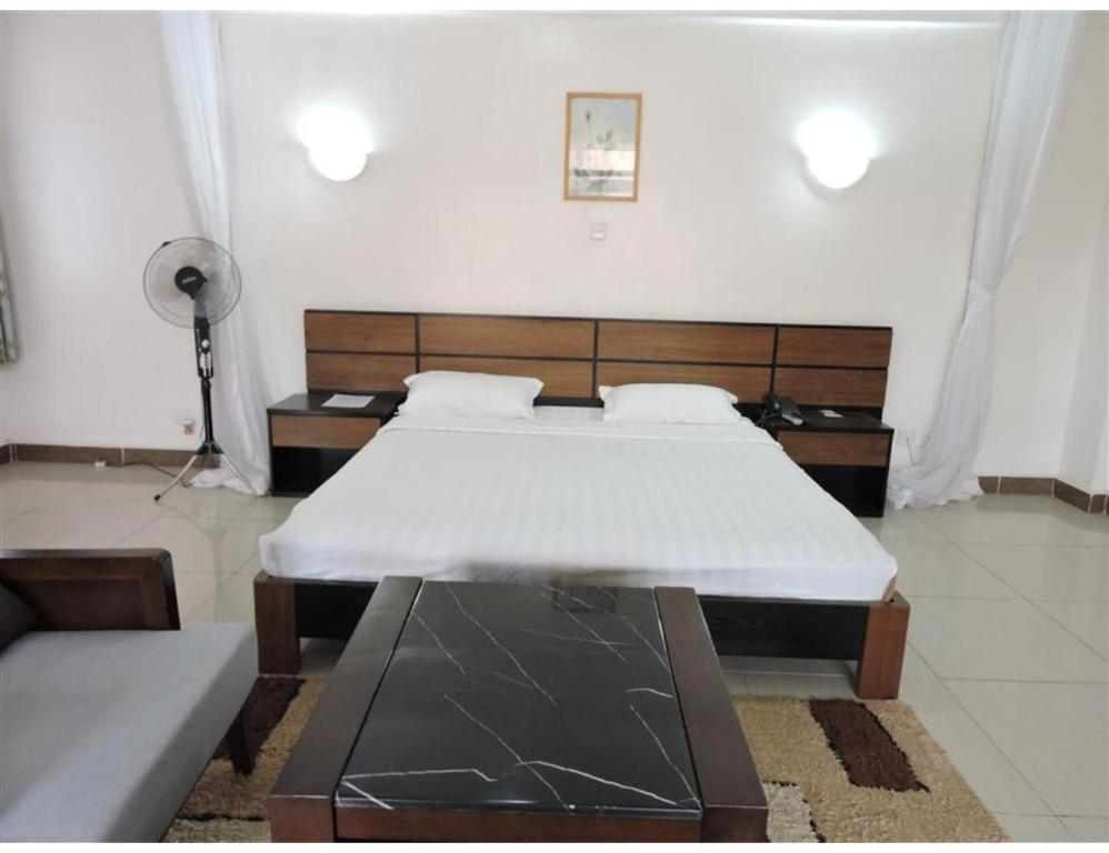 Postel nebo postele na pokoji v ubytování Sky Hotel Nairobi
