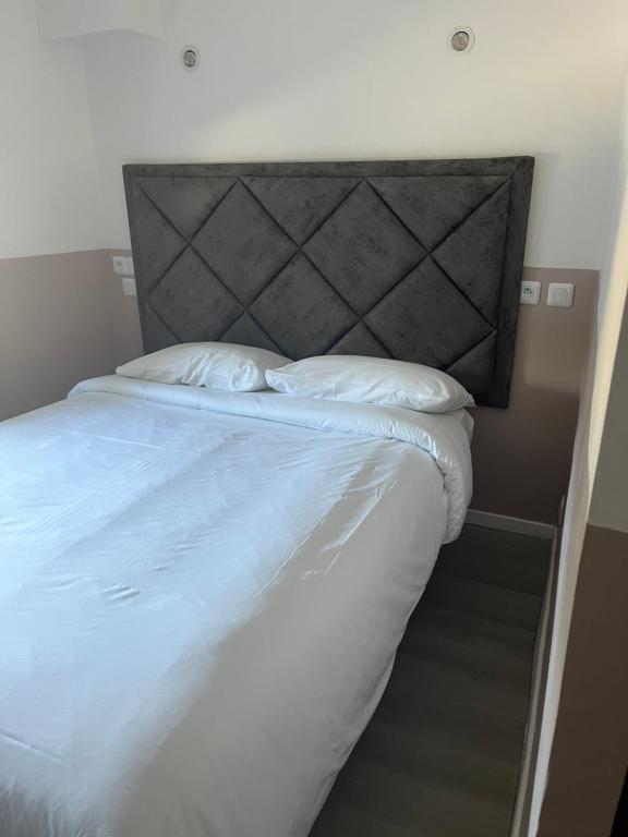 Postel nebo postele na pokoji v ubytování Hotel Aurelia