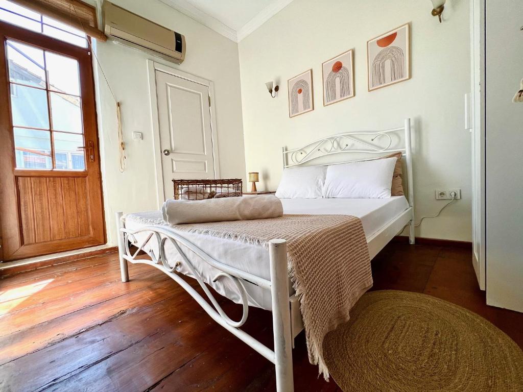 Postel nebo postele na pokoji v ubytování Hygge Ayvalık