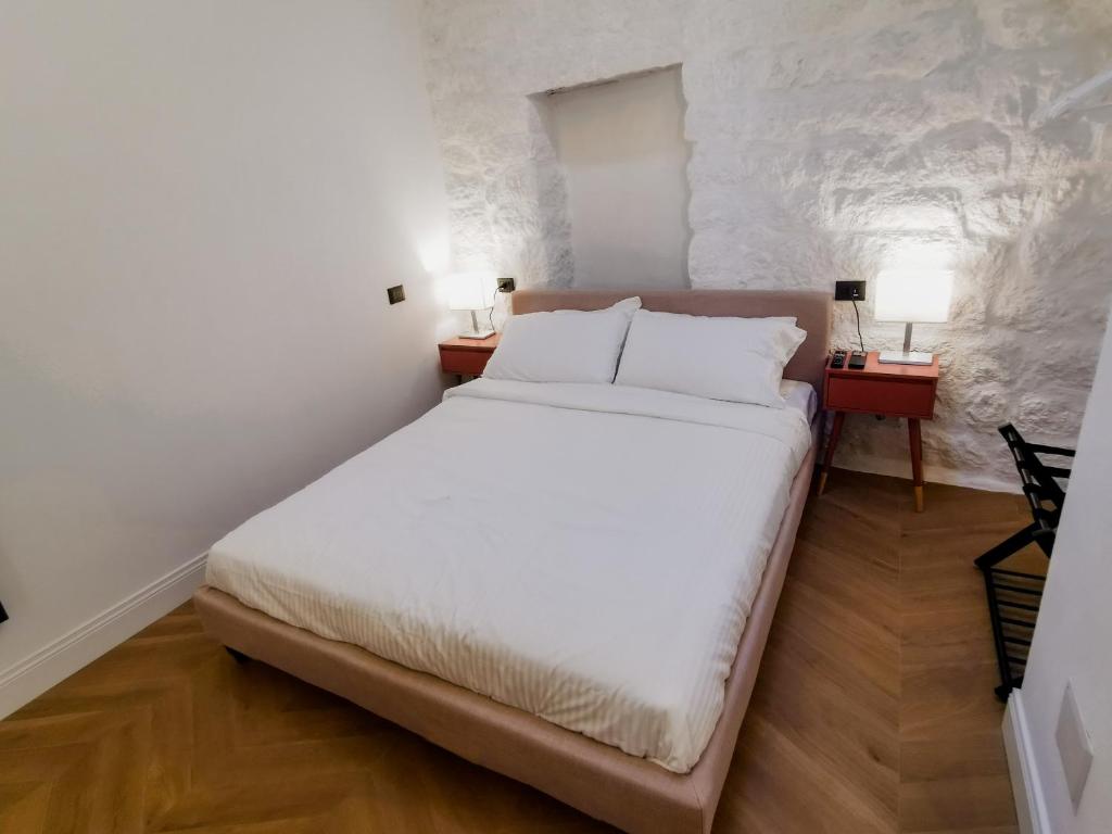 Postel nebo postele na pokoji v ubytování Affittacamere Faber