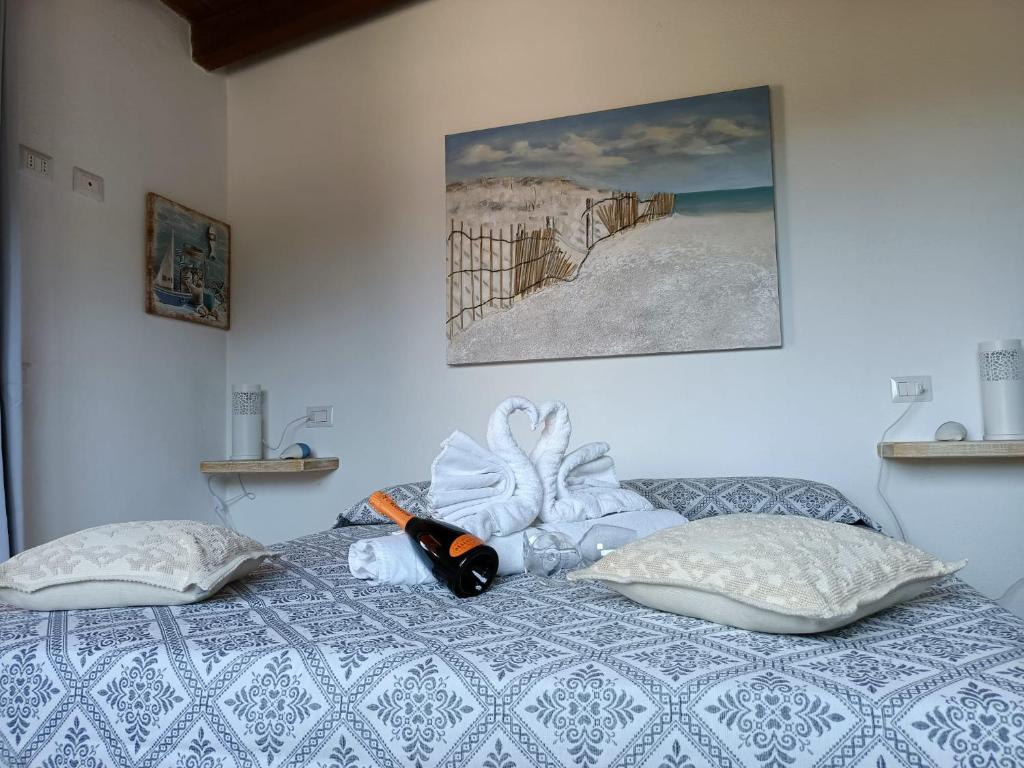 Postel nebo postele na pokoji v ubytování L'Attico Villasimius
