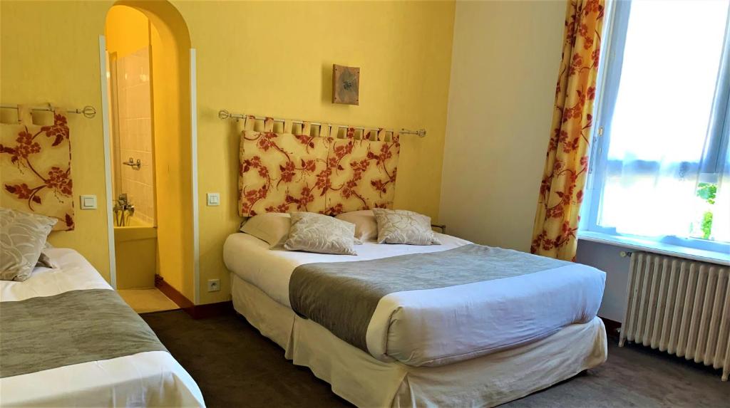 Postel nebo postele na pokoji v ubytování Les Camelias