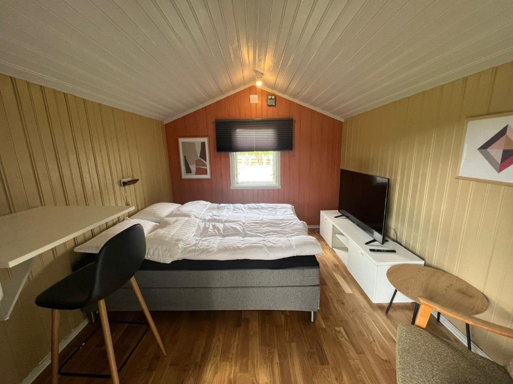 Postel nebo postele na pokoji v ubytování Neset Skydsstasjon