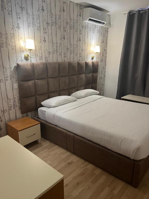 Postel nebo postele na pokoji v ubytování Hotel Aurelia