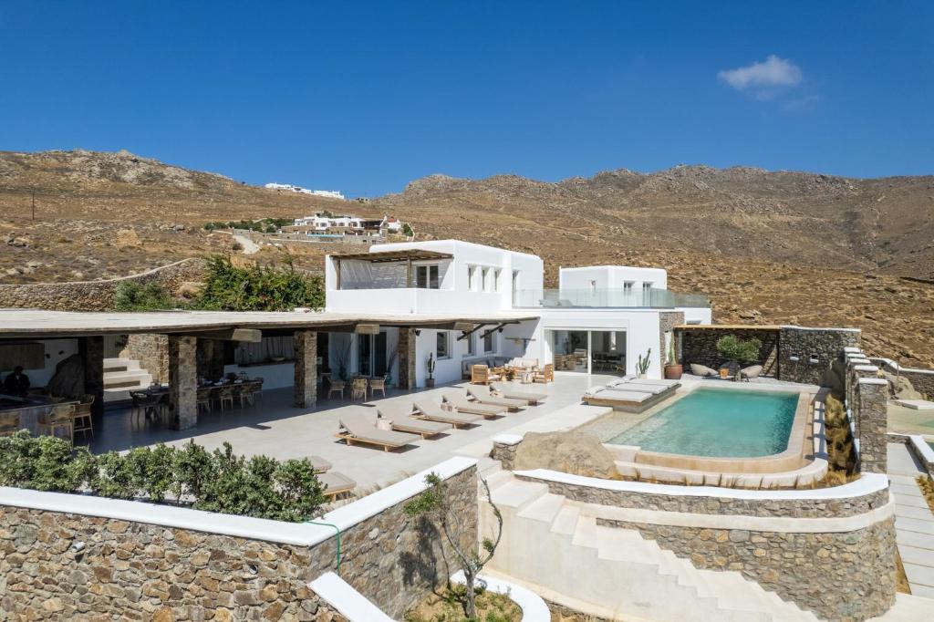 an image of a villa with a swimming pool at Mykonos Panormos Villas in Mykonos
