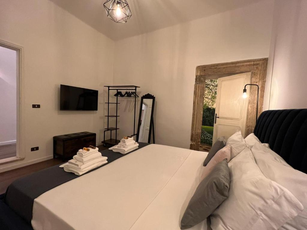 Televízia a/alebo spoločenská miestnosť v ubytovaní Appartamento via dei Pettinari