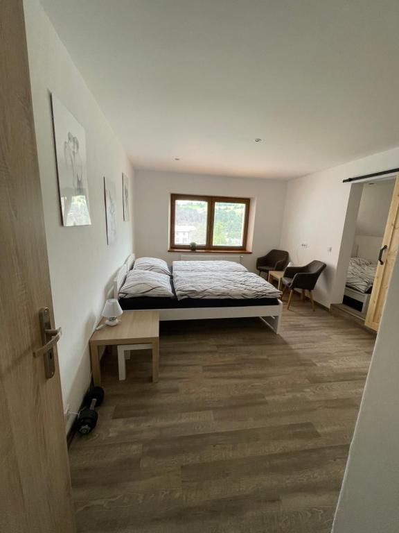 Postel nebo postele na pokoji v ubytování Wellness pobyt v Pekle