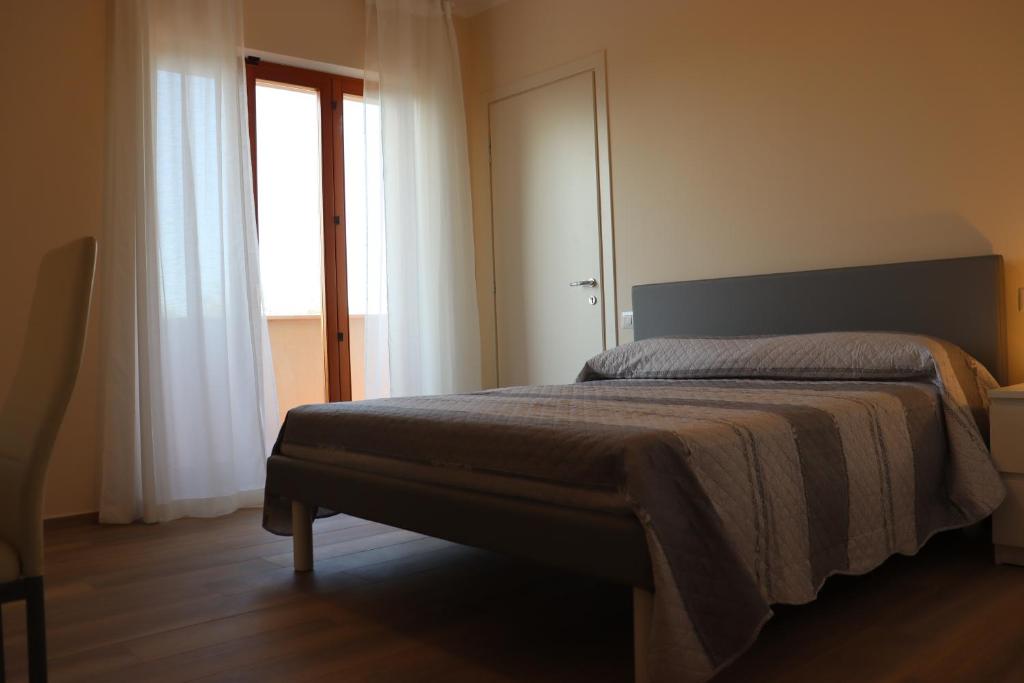 Łóżko lub łóżka w pokoju w obiekcie La Casa de Anto'