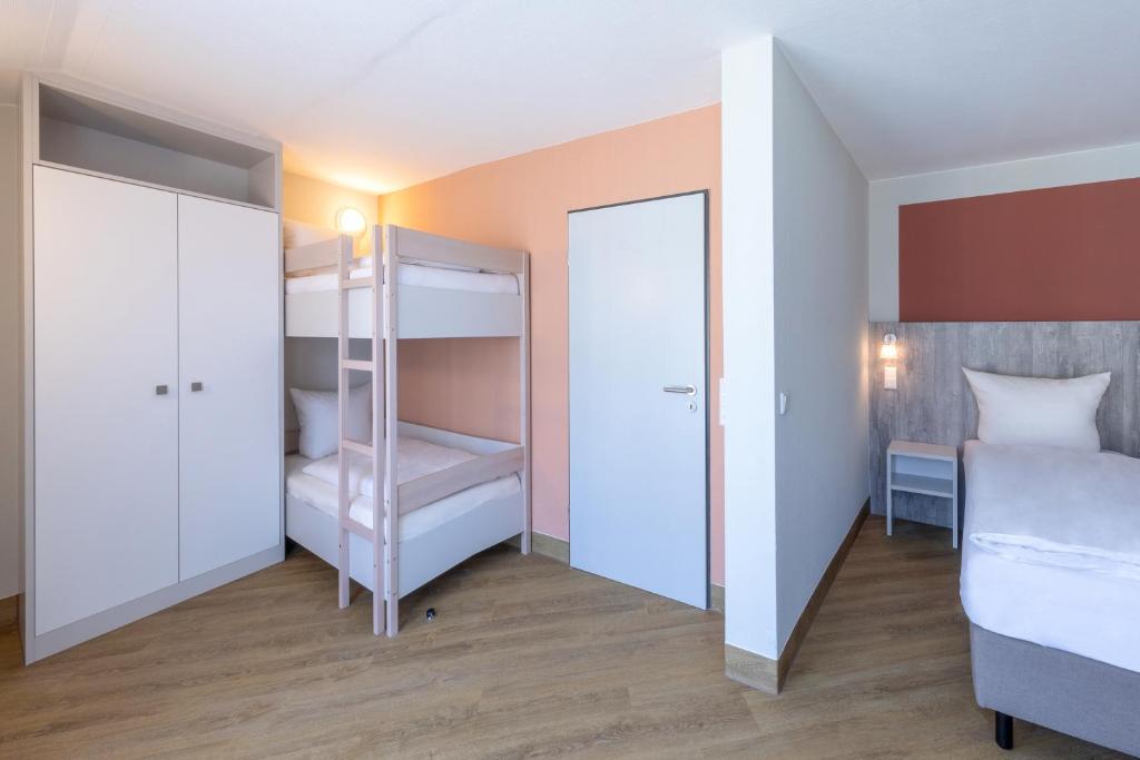Postel nebo postele na pokoji v ubytování Michels Gästehaus Meerzeit