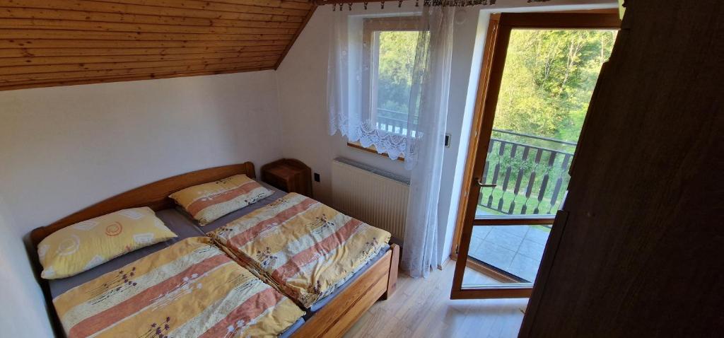 Posteľ alebo postele v izbe v ubytovaní Horská chata Zubor