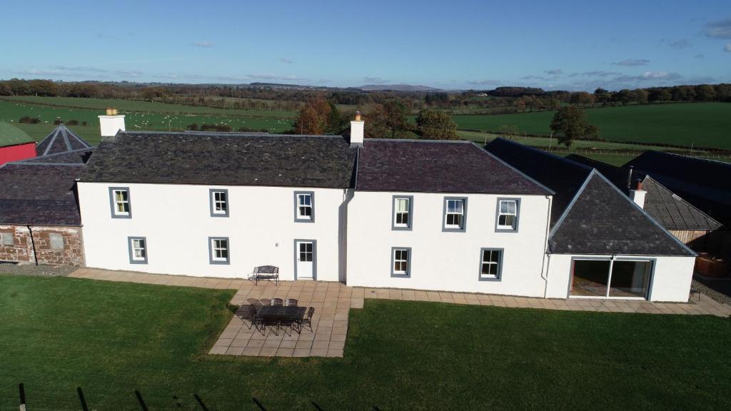 an aerial view of a large white house at Pant Farmhouse in Ayr