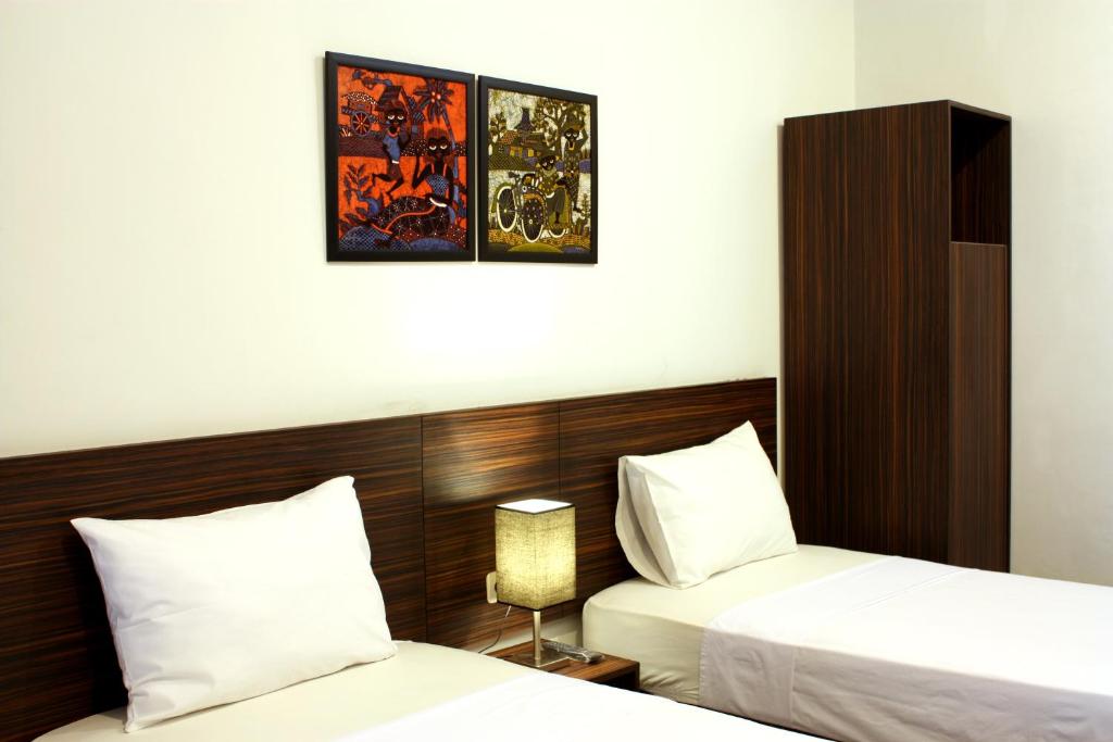 Postel nebo postele na pokoji v ubytování Grand Marto Hotel
