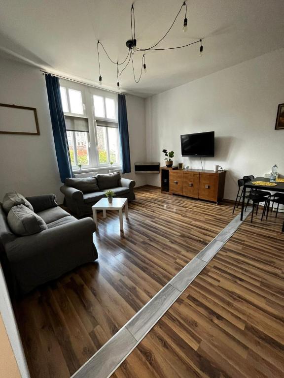 Televízia a/alebo spoločenská miestnosť v ubytovaní Kamienica4