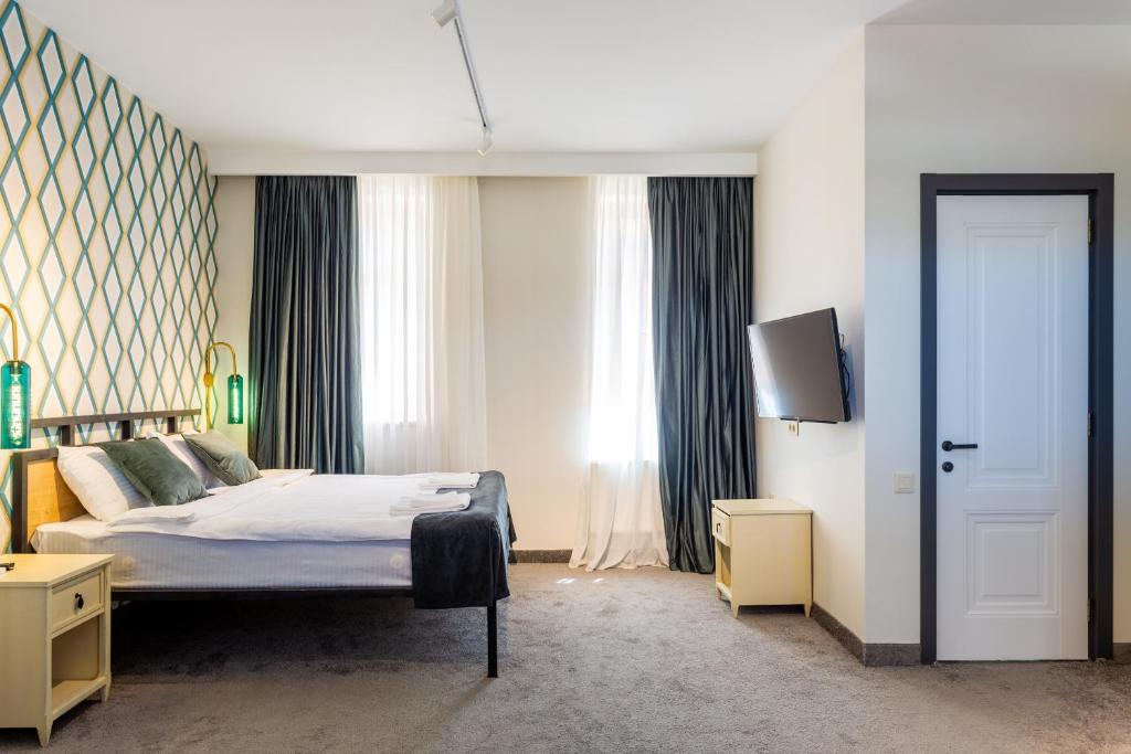 Postel nebo postele na pokoji v ubytování Betlemi Hotel