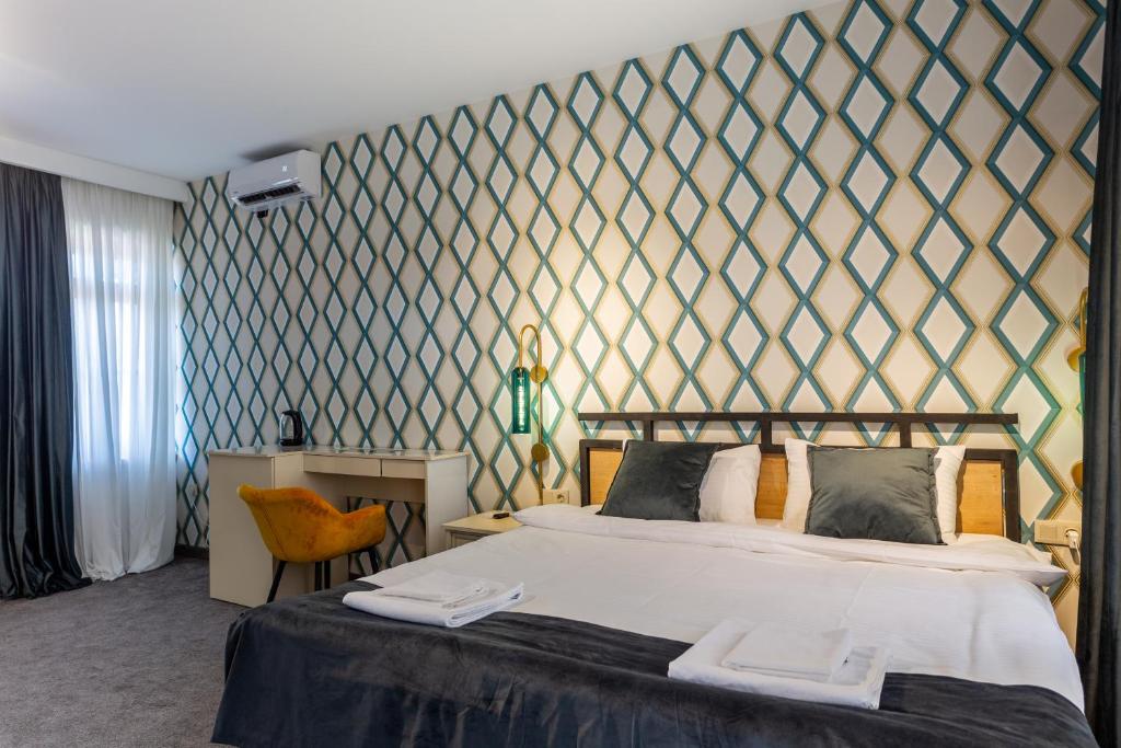 Postel nebo postele na pokoji v ubytování Betlemi Hotel