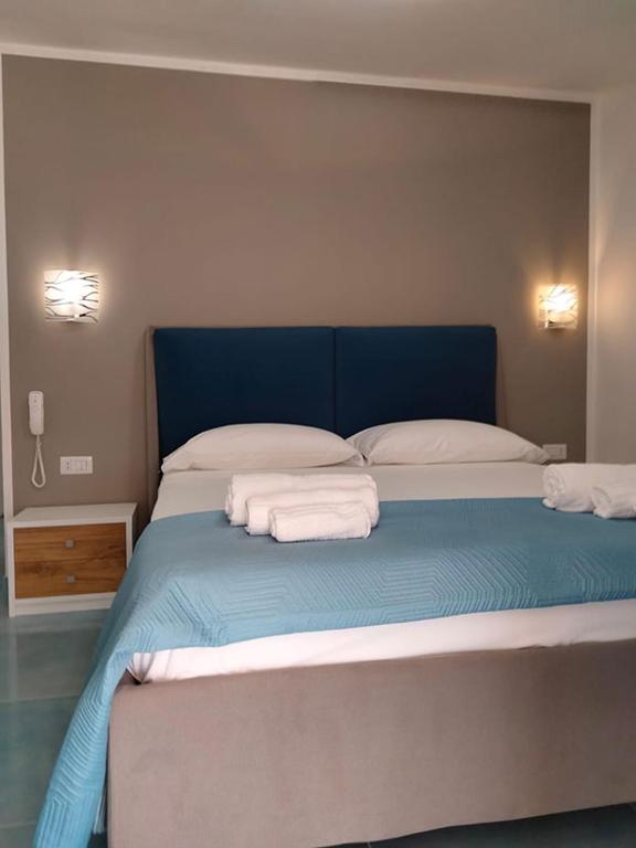 Łóżko lub łóżka w pokoju w obiekcie Hotel da Alfredo