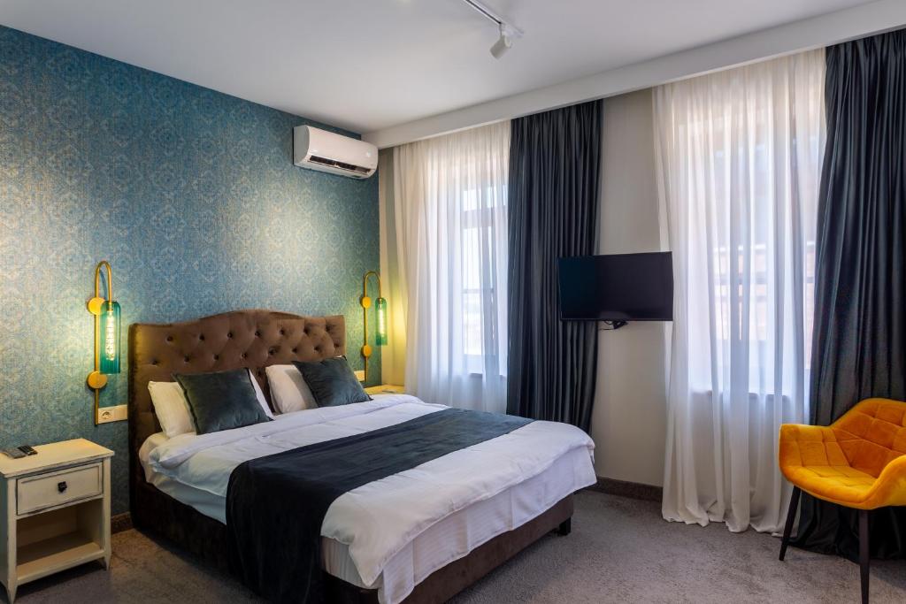 Postel nebo postele na pokoji v ubytování Betlemi Hotel