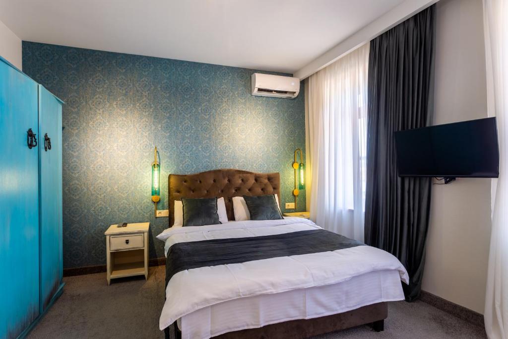 Postel nebo postele na pokoji v ubytování Betlemi Hotel