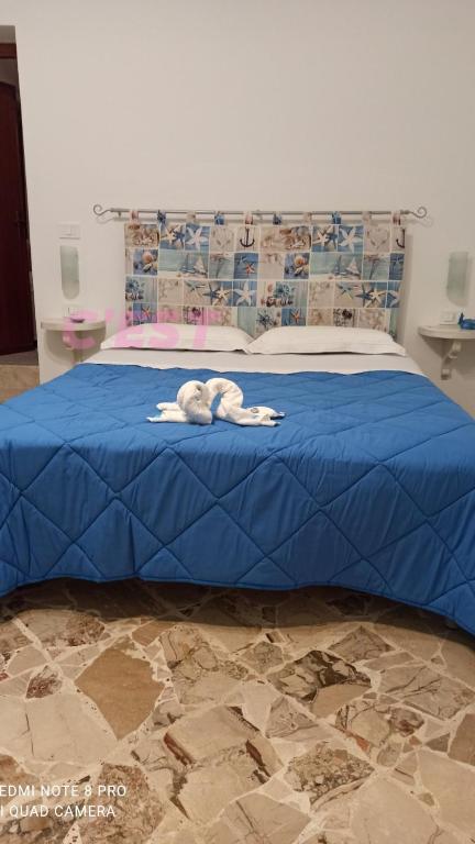 A bed or beds in a room at NARDINA HOUSE