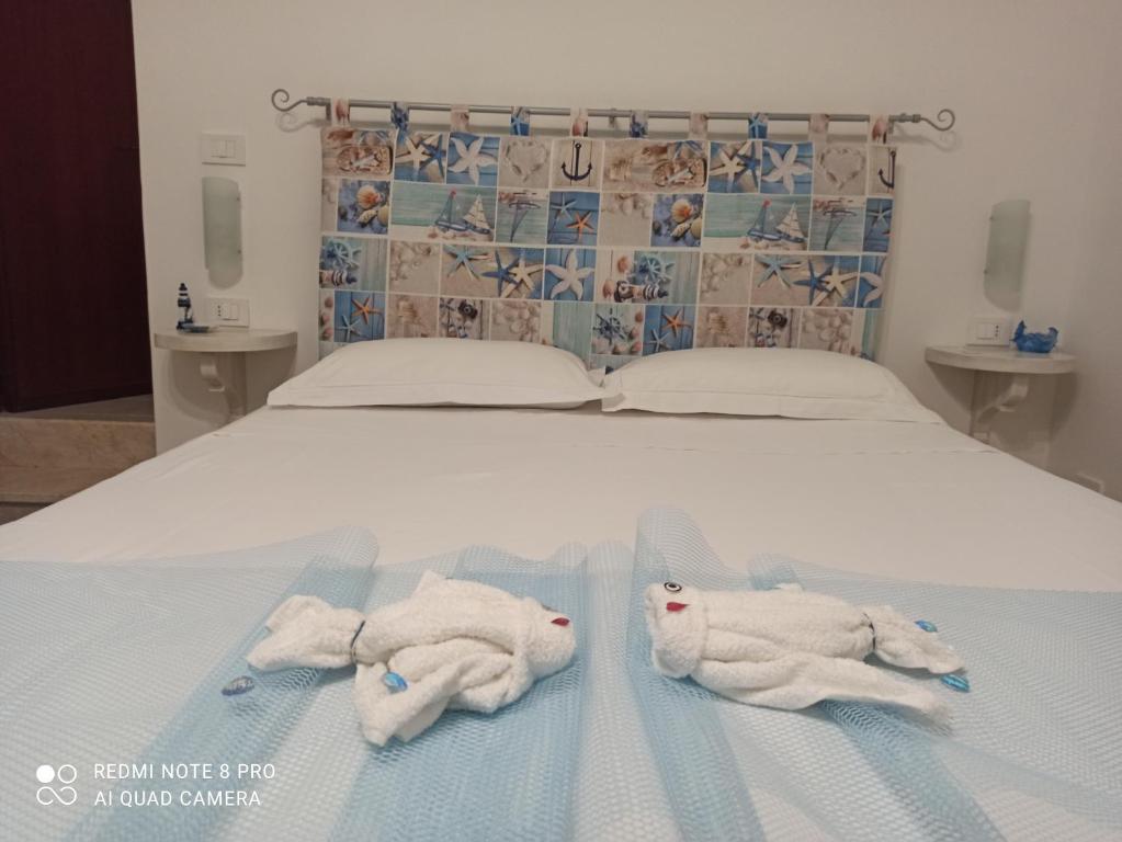 A bed or beds in a room at NARDINA HOUSE