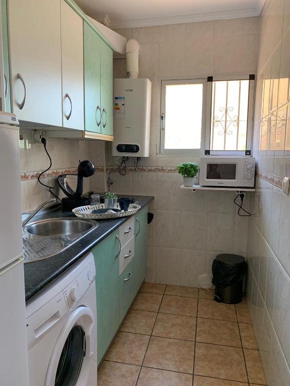 Kuchyň nebo kuchyňský kout v ubytování Apartamento El Cantal