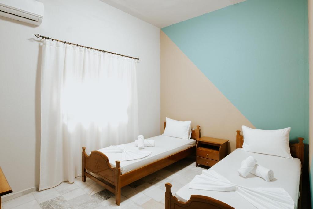 Postel nebo postele na pokoji v ubytování HOTEL LUNXHERIA