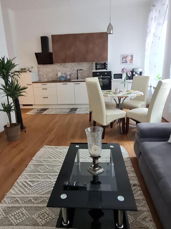 a living room with a couch and a table at Apartmenthaus Gratzer in Graz