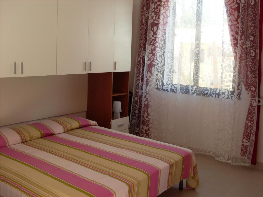 Postel nebo postele na pokoji v ubytování Vespri Siciliani