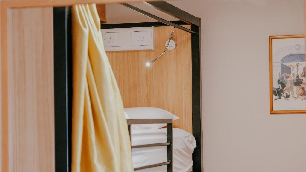 Postel nebo postele na pokoji v ubytování Garden Lane Backpackers