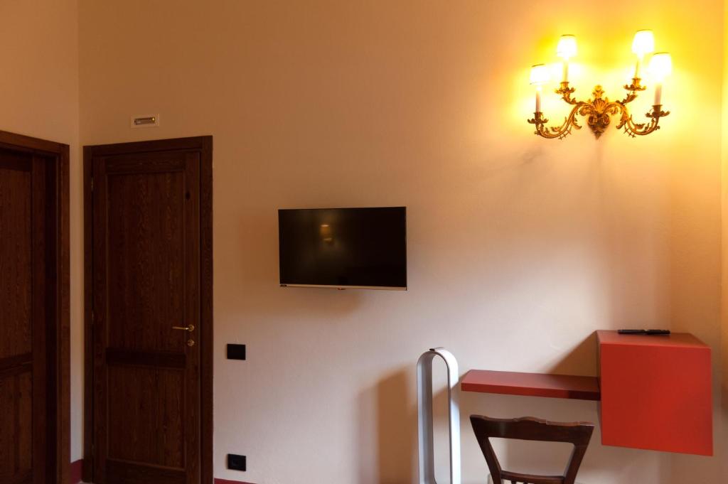 TV a/nebo společenská místnost v ubytování Palazzo Benucci