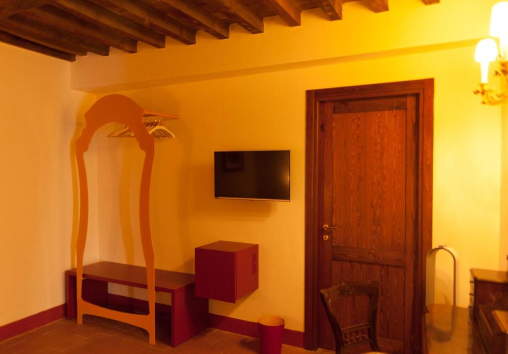 TV a/nebo společenská místnost v ubytování Palazzo Benucci