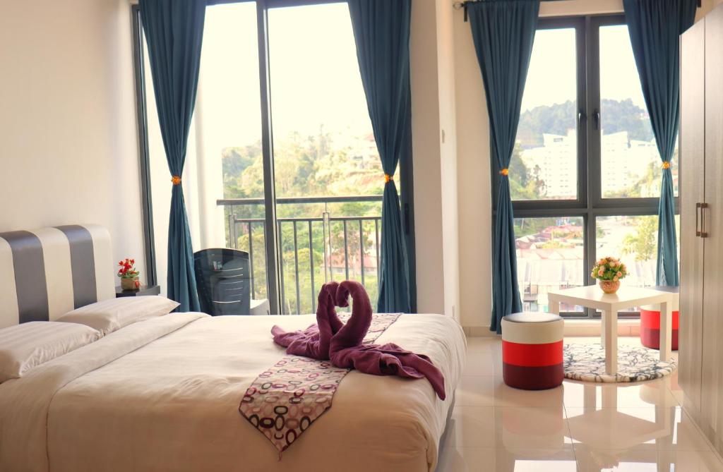 Postel nebo postele na pokoji v ubytování ATS Cameron Hotel & Apartments