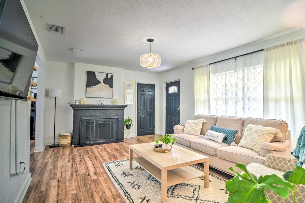 a living room with a couch and a fireplace at Family-Friendly Clearwater Home with Game Room! in Clearwater