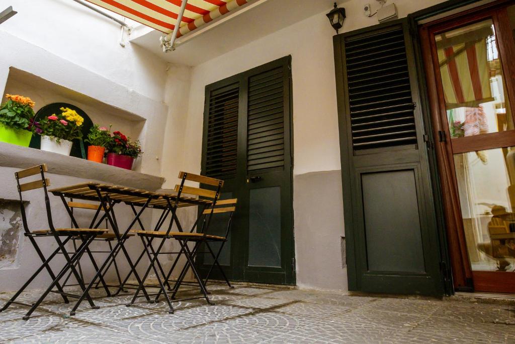 a table and chairs in front of a building at Sweet House in Nocera Inferiore