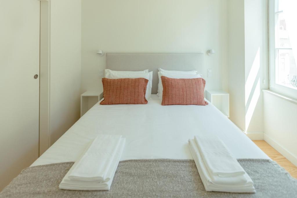 Postel nebo postele na pokoji v ubytování Trindade 19 Apartments - 2B Touriga Nacional