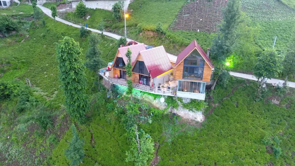 an aerial view of a house on a hill at Ekakta bungalov in Çamlıhemşin