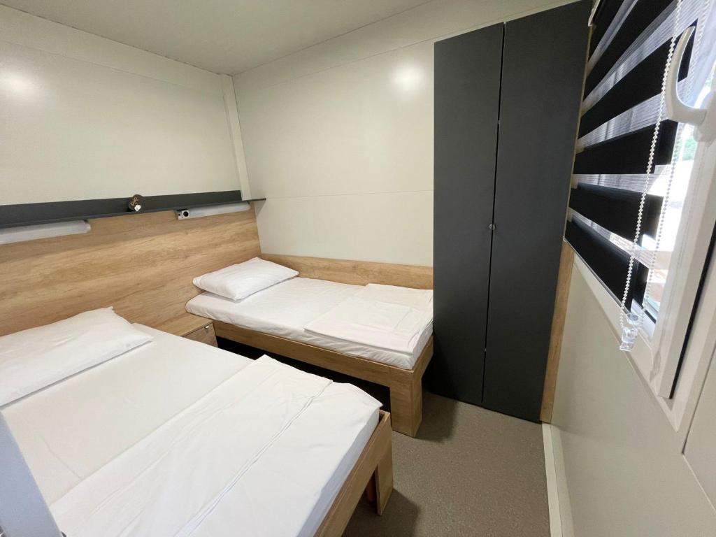 Posteľ alebo postele v izbe v ubytovaní D&I mobile home