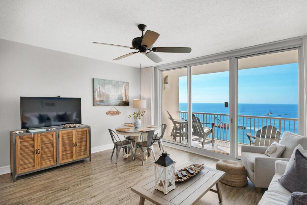 a living room with a view of the ocean at Majestic Beach Towers 1-1006 in Panama City Beach