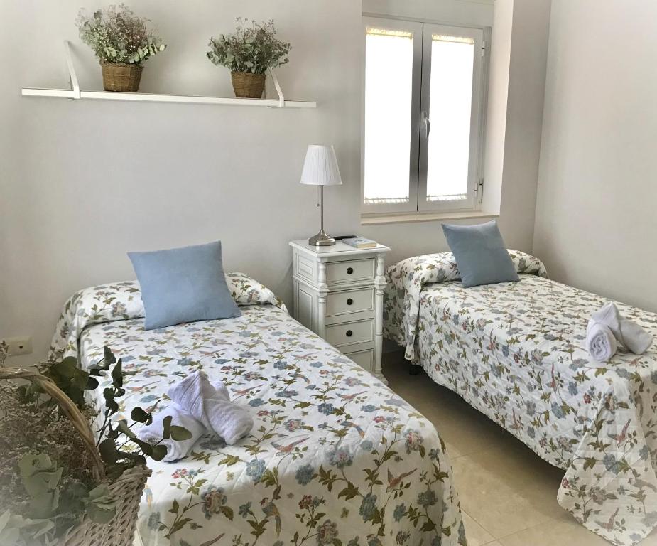 Posteľ alebo postele v izbe v ubytovaní Apartamento Las Flores