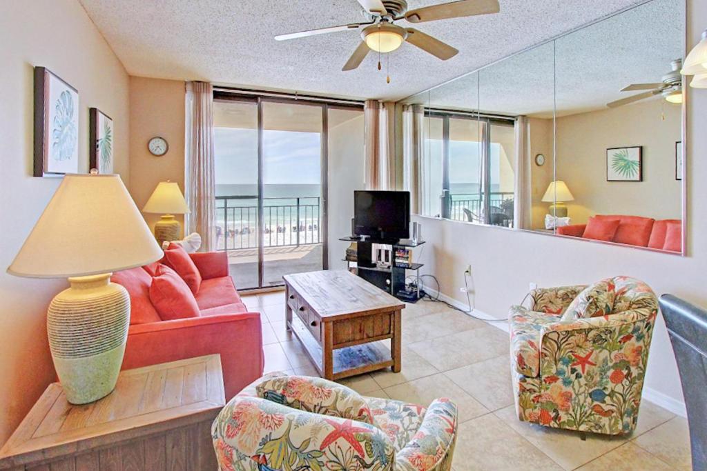 a living room with a view of the ocean at Nautilus 1303 in Fort Walton Beach