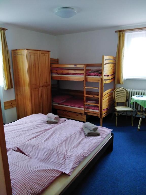 Postel nebo postele na pokoji v ubytování Penzion Iris Krkonoše