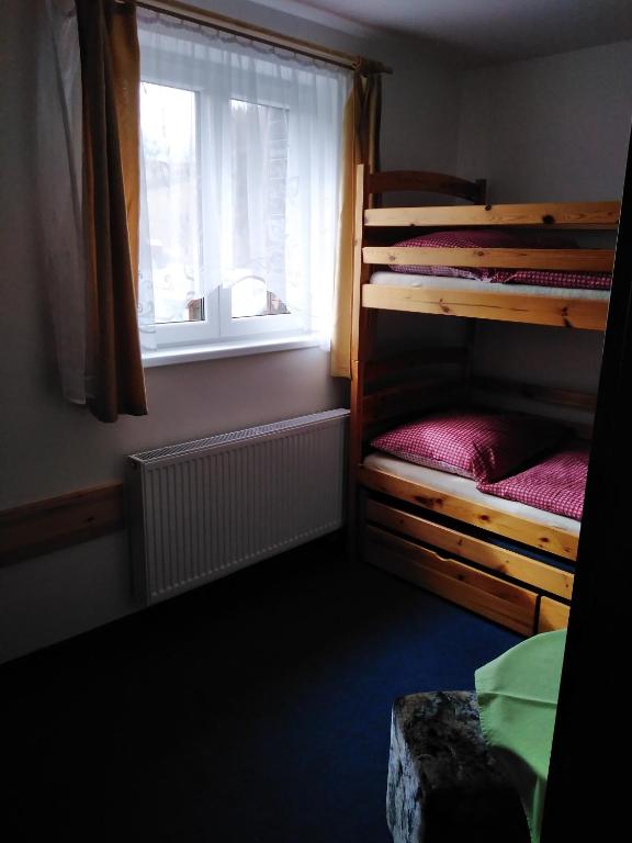 Postel nebo postele na pokoji v ubytování Penzion Iris Krkonoše