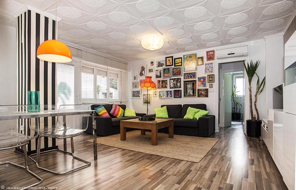 a living room with a couch and a table at Ku Apartment in Murcia